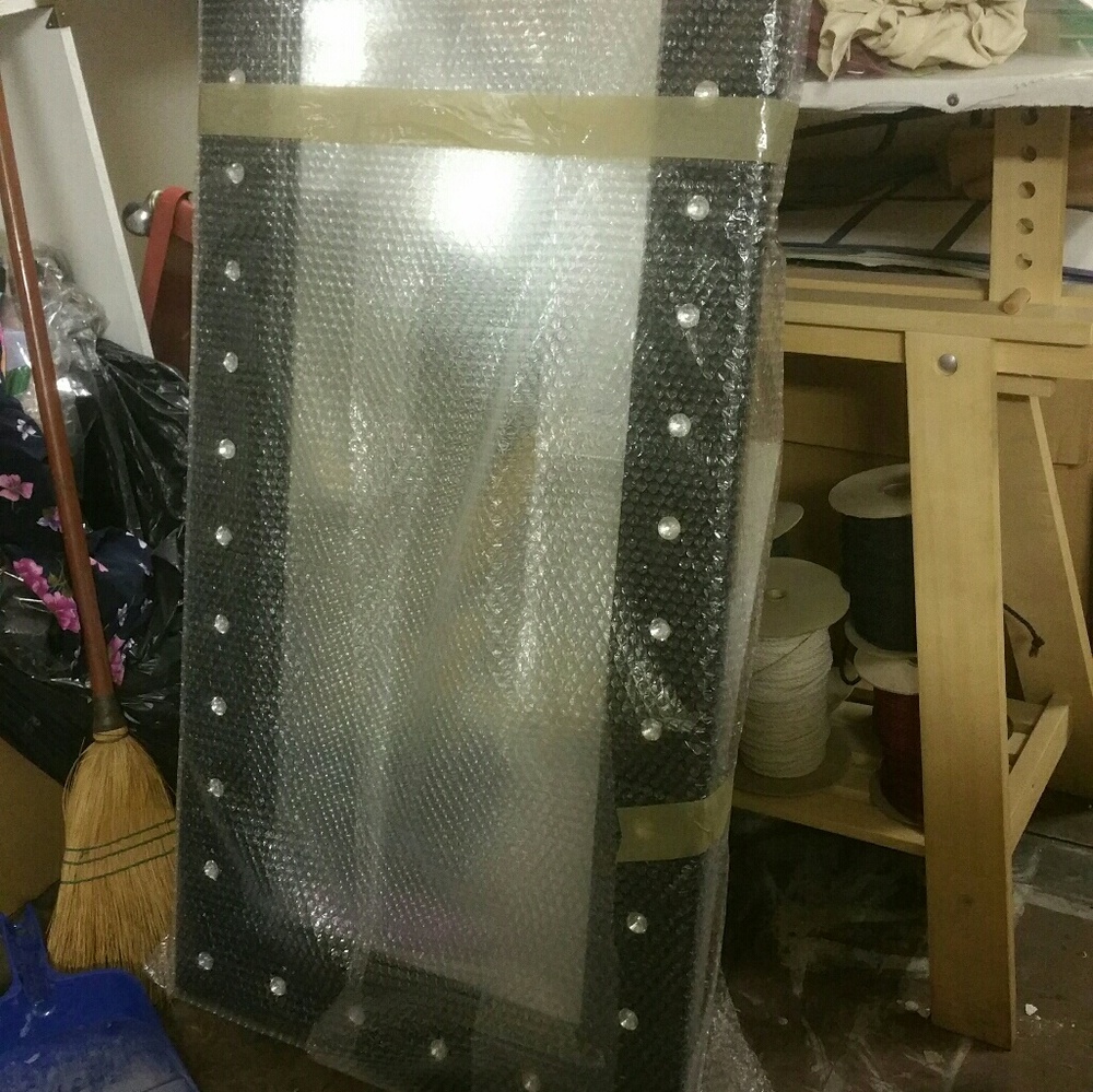 Black tufted mirror